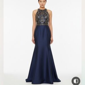 Xscape Beaded Open-Back
Mermaid Halter Royal Blue Gown